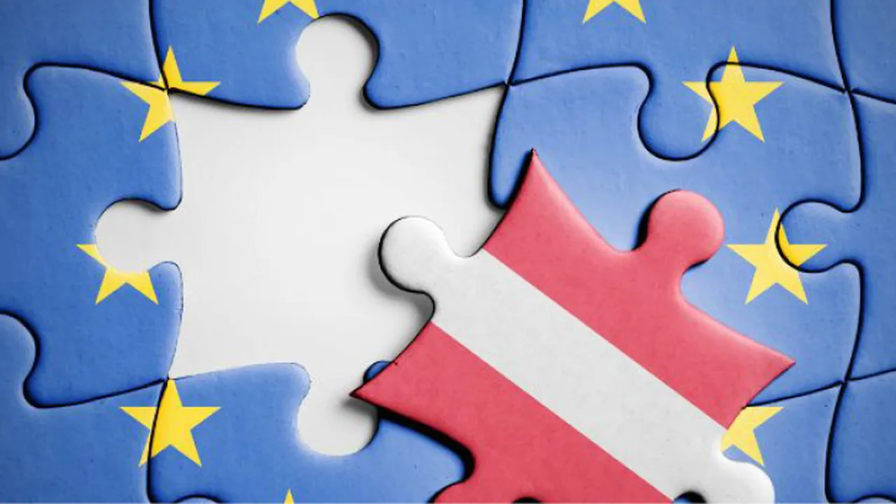 Puzzleteile mit den Flaggen der Europäischen Union und Österreichs